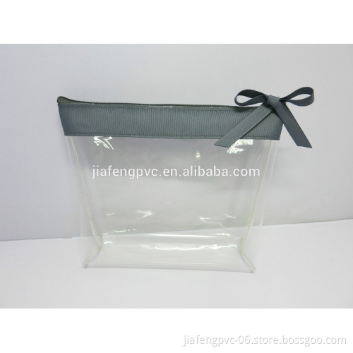 Audit factory TPU cosmetic bag with bowknot zipper puller